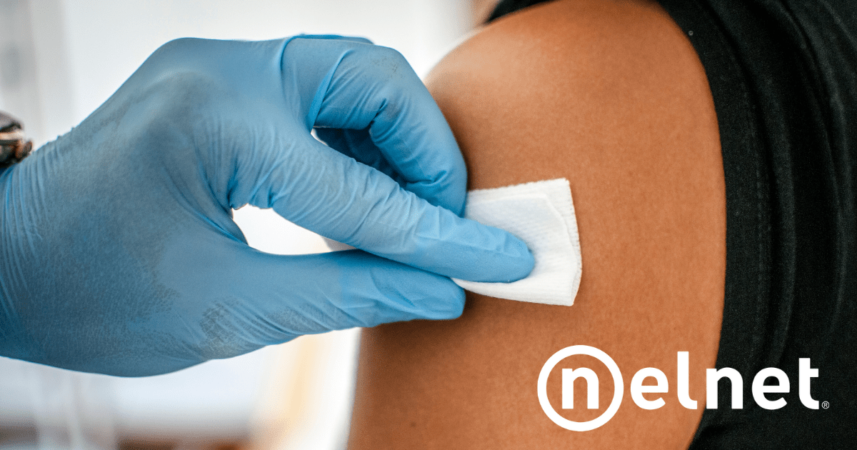 2020 Flu Shots - A gloved healthcare representative preps an arm for a flu shot.